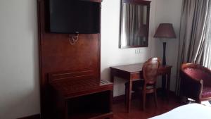 Postel nebo postele na pokoji v ubytování FT Hotel