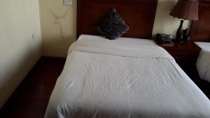 Postel nebo postele na pokoji v ubytování FT Hotel