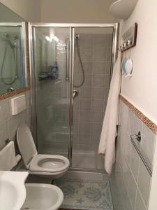 a bathroom with a shower and a toilet and a sink at AffittaSardegna- Bilo Candido in Stintino
