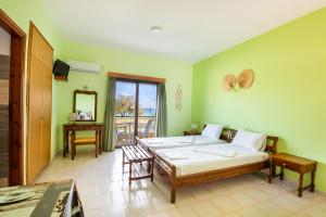 Postel nebo postele na pokoji v ubytování Sun Beach Apartments