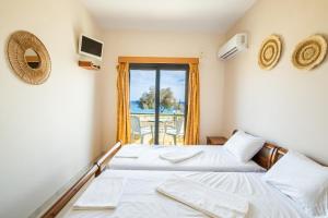 Postel nebo postele na pokoji v ubytování Sun Beach Apartments