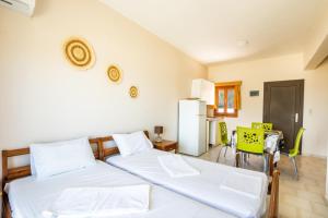 Postel nebo postele na pokoji v ubytování Sun Beach Apartments