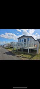a row of mobile homes on the side of the road at Waterfront Kent coast in Rochester