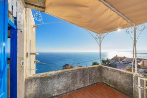 a view of the ocean from the balcony of a house at Casa Maiolica in Finale Ligure +28 photos