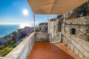 a balcony with a view of the ocean at Casa Maiolica in Finale Ligure