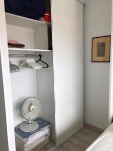 a white closet with a fan in a room at Henea in Saint-Paul-lès-Dax +16 photos