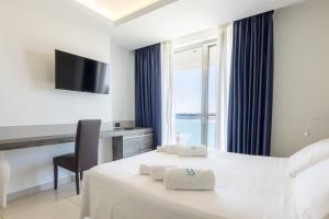 Letto o letti in una camera di Hotel Belvedere