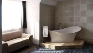 Koupelna v ubytování Hôtel Le Dormeur