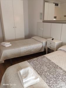 Posteľ alebo postele v izbe v ubytovaní Hotel Principe