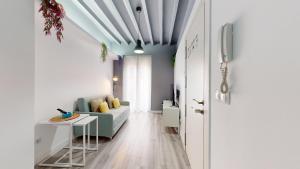 a living room with a couch and a table at Myflats Old Corner in Alicante