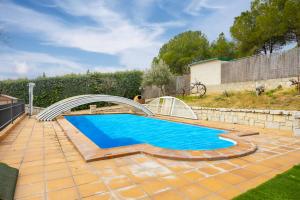 a swimming pool with a slide in a yard at - venturural - in Venturada