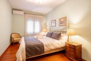 a bedroom with a bed and a dresser and a window at - venturural - in Venturada +20 photos