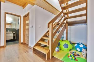 a childs room with a staircase in a house at Chata FONGRUB in Mýto pod Ďumbierom