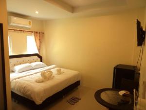 Postel nebo postele na pokoji v ubytování Bann Lom Le Guest House