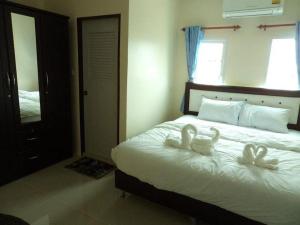 Postel nebo postele na pokoji v ubytování Bann Lom Le Guest House