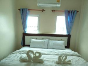 Postel nebo postele na pokoji v ubytování Bann Lom Le Guest House
