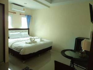 Postel nebo postele na pokoji v ubytování Bann Lom Le Guest House