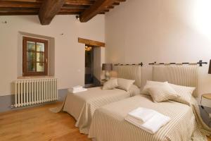 Postel nebo postele na pokoji v ubytování Villa Il Troscione + 33 fotografií