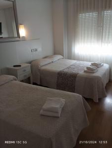 Posteľ alebo postele v izbe v ubytovaní Hotel Principe