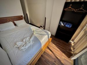 Ένα ή περισσότερα κρεβάτια σε δωμάτιο στο Apu Wasi