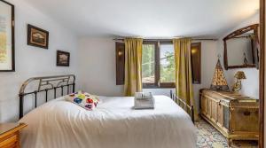 a bedroom with a white bed and a window at Spacious villa with mountain view and pool in Baza in Baza