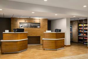 a store with wooden walls and wooden counters in a room at Courtyard by Marriott Atlanta Northlake in Atlanta +29 photos