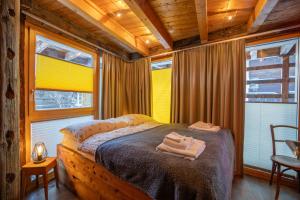 Letto o letti in una camera di Chalet Schwalbennest