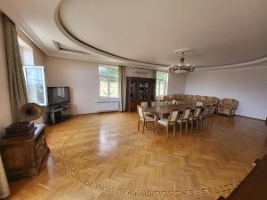 a dining room with a table and chairs at Novxani - Novkhani Villa Lux in Baku