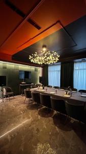a large conference room with a long table and chairs at Empire City in Karagandy