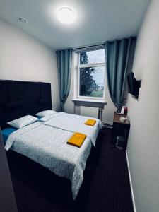 Postel nebo postele na pokoji v ubytování AJ Chocolate Vilnius + 37 fotografií