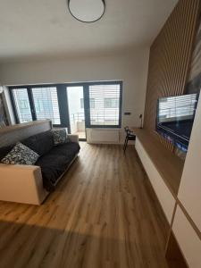Televízia a/alebo spoločenská miestnosť v ubytovaní Apartment VAŇKOVKA