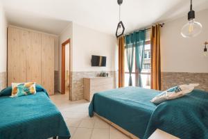 Postel nebo postele na pokoji v ubytování Giramondo Guest house