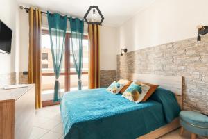 Postel nebo postele na pokoji v ubytování Giramondo Guest house