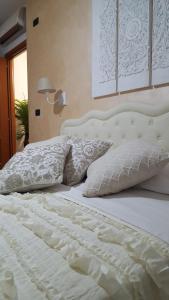 Postel nebo postele na pokoji v ubytování Giramondo Guest house