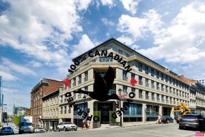 a large building with a sign on the top of it at Hygie Boutique Hotel in Montreal