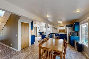 a kitchen and dining room with a wooden table at Happy Clam in Waldport