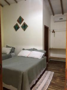 a bedroom with a bed in a room at CASA MEDNA in Trancoso