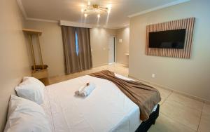 Postel nebo postele na pokoji v ubytování Lusobra Flats Maragogi