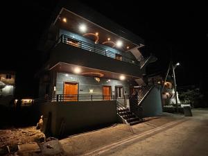 a house at night with lights on top of it at MEENAKSHI GUEST Inn in Hampi
