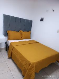 En eller flere senger på et rom på Aparta Hotel Jiménez