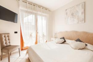 Postel nebo postele na pokoji v ubytování Giramondo Guest house