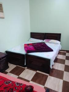 Postel nebo postele na pokoji v ubytování فندق ومطعم البرج