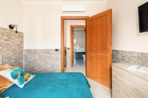 Postel nebo postele na pokoji v ubytování Giramondo Guest house