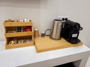 a counter with a coffee maker on a counter top at Giandra Rooms and Garden in Messina
