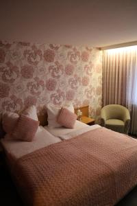 Postel nebo postele na pokoji v ubytování Hotel Hohe Wart