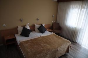 Postel nebo postele na pokoji v ubytování Hotel Hohe Wart + 9 fotografií