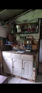 a kitchen filled with lots of pots and pans at Camping Serra São José in Tiradentes