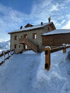 Baita della Valle - Appartamento Stella Alpina om vinteren