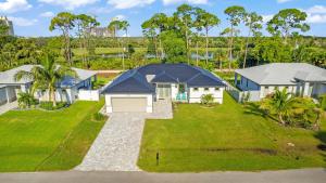 an aerial view of a house with a yard at Hidden Gem, Heated Pool & Spa - Enchanted El Dorado Retreat - Roelens in Bonita Springs