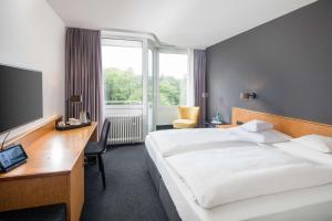 Postel nebo postele na pokoji v ubytování Best Western Hotel Kaiserslautern